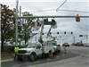 Crews Install Street Name Signs on the New Mast Arms at Intersections Along South Gilmore