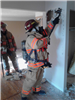 Firefighters Practice an Interior Wall Breech