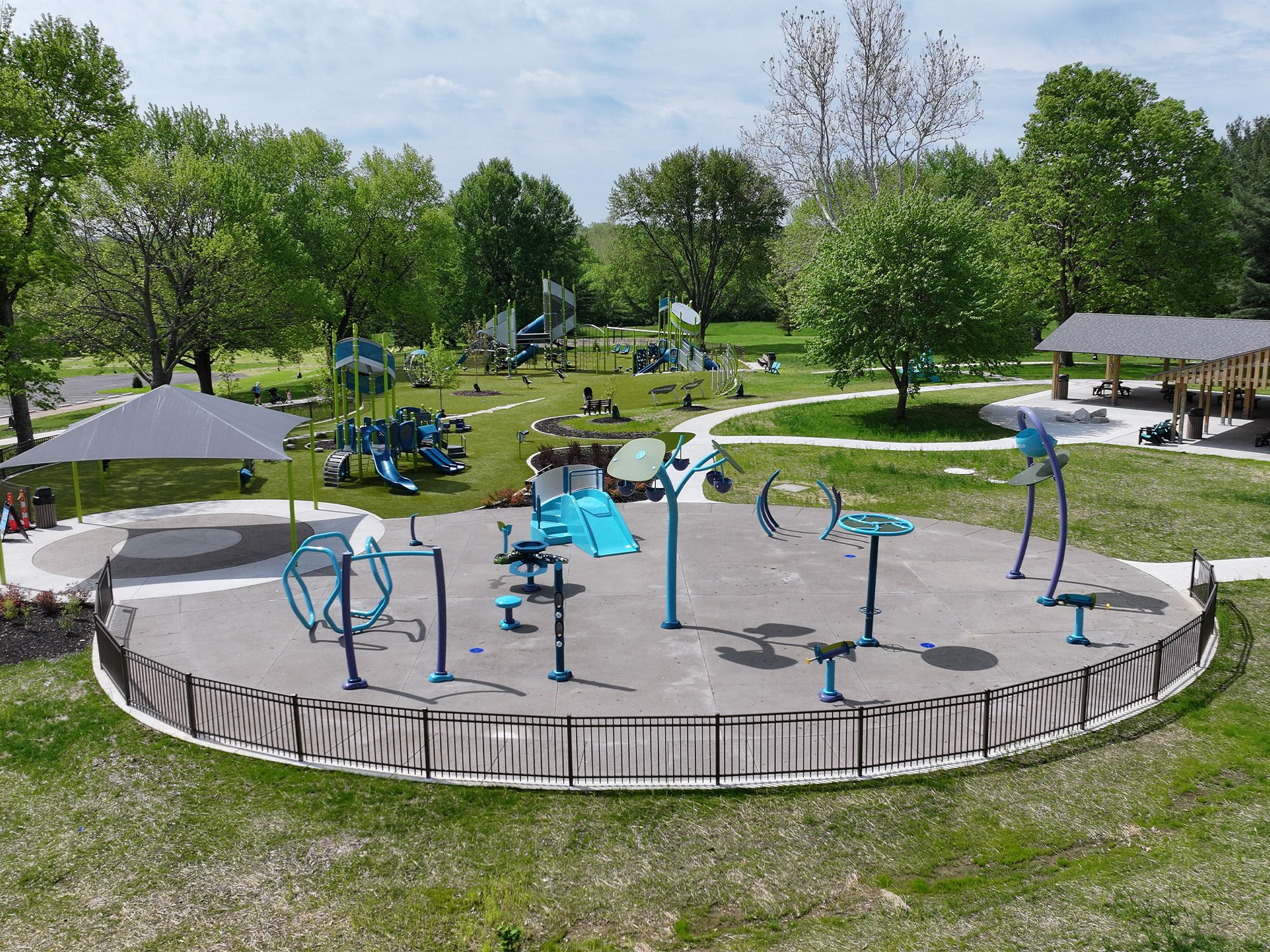 Shaded play area with new splash pad equipment
