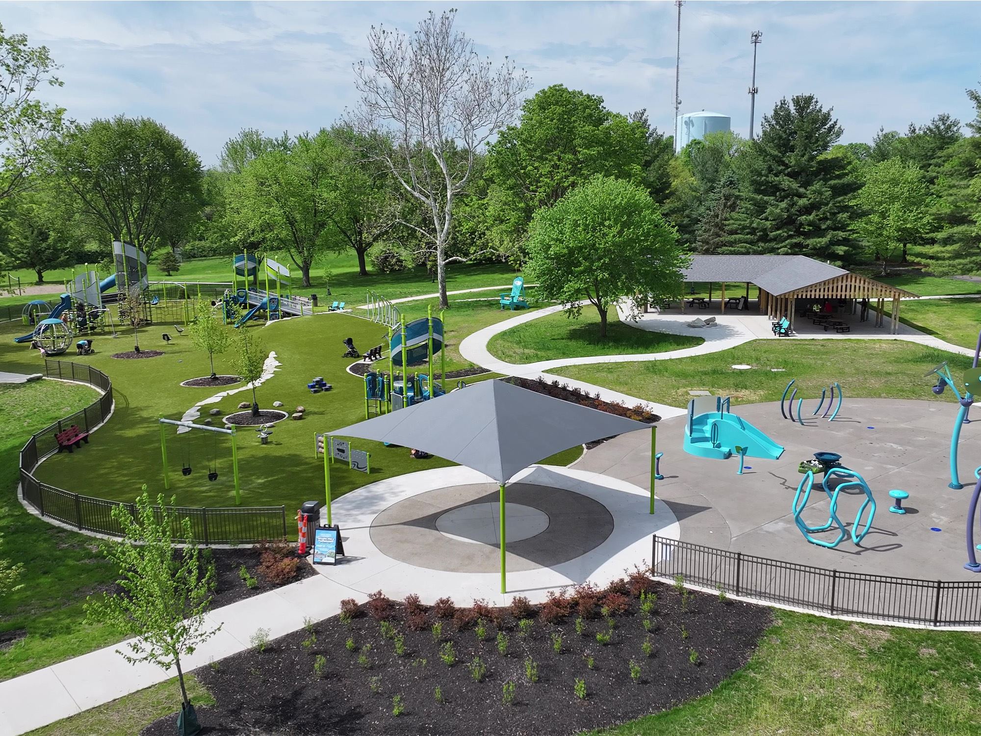 Wide view of playground, pavilion, and walking paths