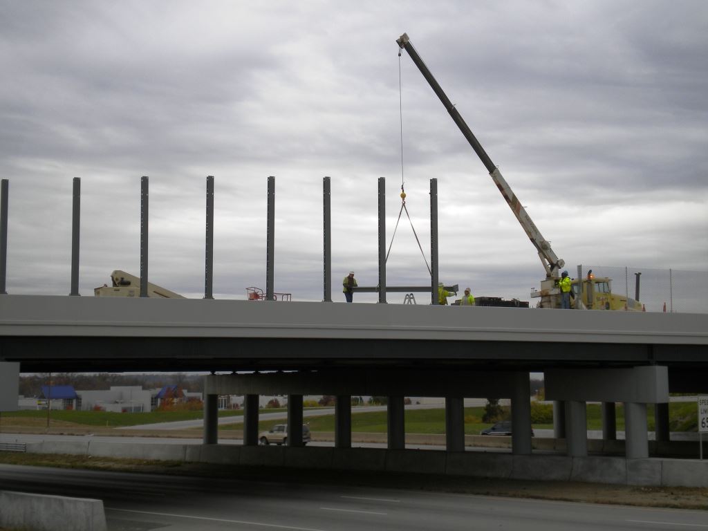 Workers From Security Fence Begin Work on the Bridge's Architectural Details
