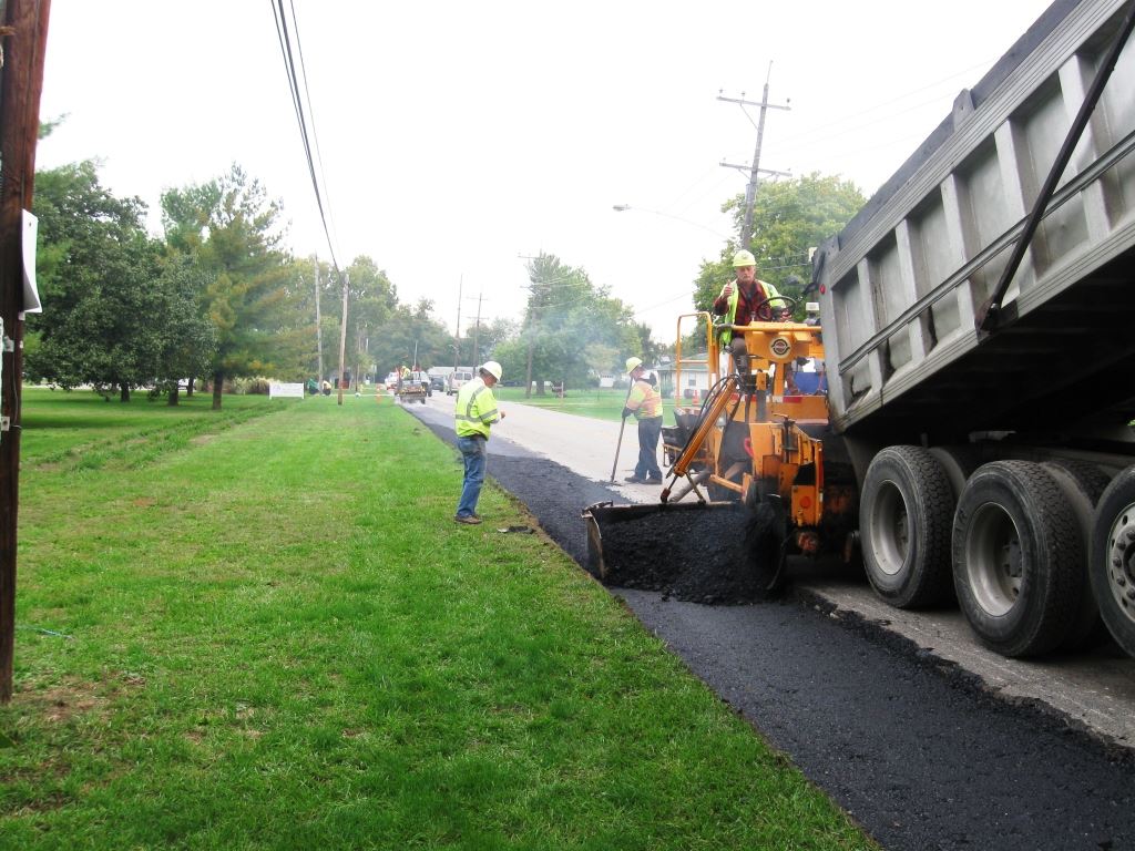 Day One: Before our trusty photographer could get to the scene, crews had milled and excavated the existing pavement and begun filling the void with asphalt