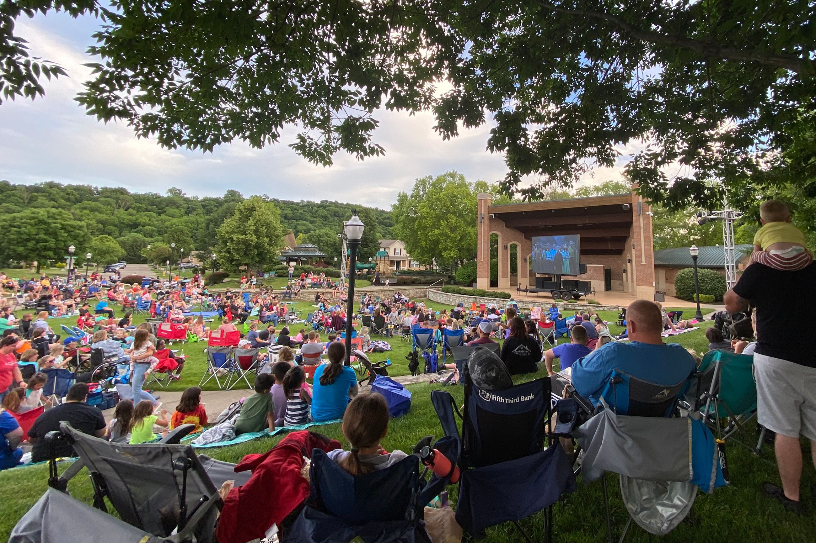 Crowd watching a movie in the park. 